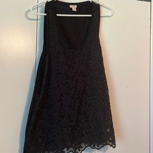 Sleeveless Black tank top with overlay.